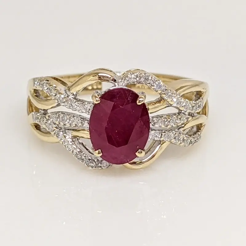 14K ENHANCED RUBY OVAL 6X8 WITH .20 DIAMOND TOTAL WEIGHT ESTATE RING 3.9 GRAMS